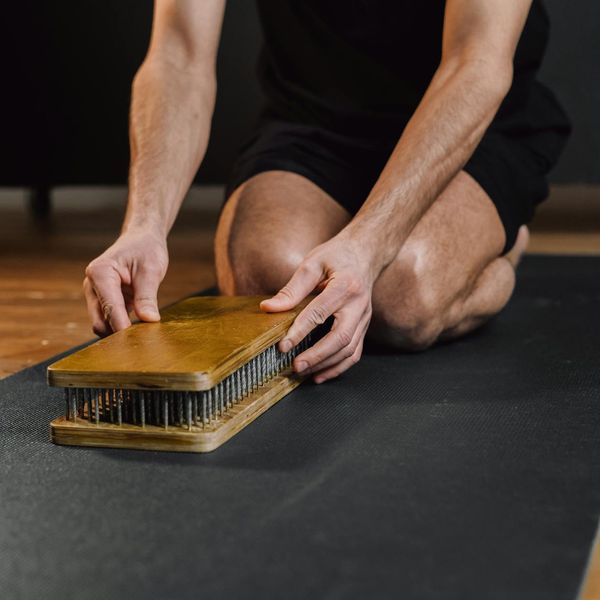 Man meditating after a workout, showing mental calm and focus.